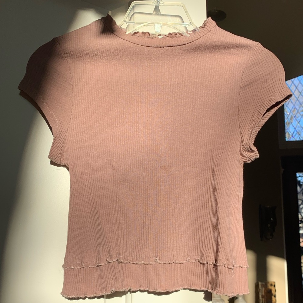 Mauve, ruffled, cropped shirt from Altar’d State